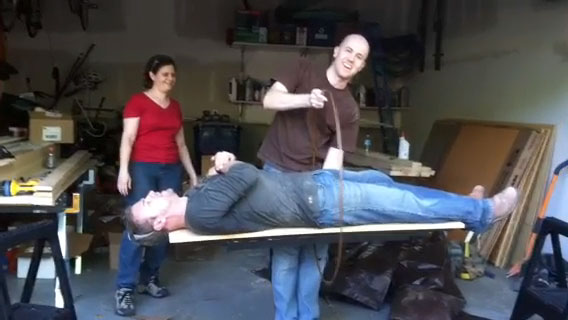 Adam levitating Matt Muenster on the set of Bath Crashers